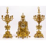 A FRENCH BRASS GARNITURE CLOCK the movement by Barrard & Vignon, all with scrolling pierced