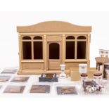 A SEMI CONSTRUCTED DOLL'S HOUSE MODEL BARN 43cm wide together with a quantity of doll's house