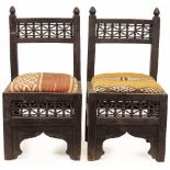 A PAIR OF 20TH CENTURY MOORISH STYLE LOW CHAIRS with embroidered upholstered seats with fret