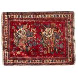 A RED GROUND AFSHAR GOL FARANG with a banded border and flower head motifs, 112cm x 144cm