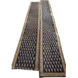 AN EARLY TO MID 20TH CENTURY PERSIAN STYLE LONG WOOLLEN RUNNER with a blue ground and geometric