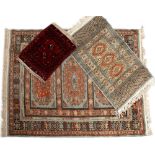 TWO 20TH CENTURY MIDDLE EASTERN CARPETS and one Hamadan style prayer mat, the prayer mat 58cm x 49cm