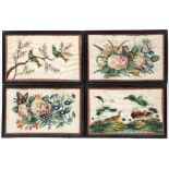 A PAIR OF ANTIQUE CHINESE RICE PAPER PICTURES depicting exotic birds amongst foliage, each