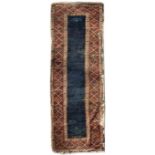 AN EARLY TO MID 20TH CENTURY WOOL WORK KELIM RUG with fringed edges and blue central panel with