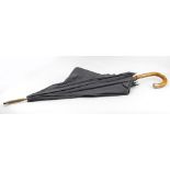 A CROOK HANDLED UMBRELLA with silver mounts 94cm in length