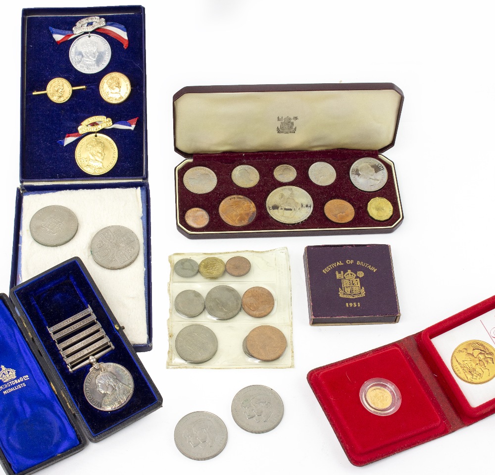 A QUANTITY OF COINS to include a 1980 gold half sovereign