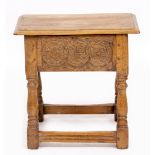 AN OAK JOINT STOOL with a lifting lid 48cm wide x 27cm deep x 47cm high