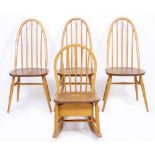 A SET OF THREE ERCOL LIGHT ELM SPINDLE BACK CHAIRS with an Ercol style rocking chair (4)