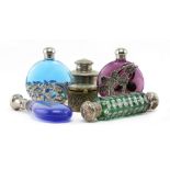 A COLLECTION OF SIX WHITE METAL MOUNTED GLASS SCENT BOTTLES to include moon flask style examples,