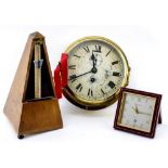 A BRASS CASED SHIP'S CLOCK the painted dial with Roman numerals and a subsidiary second hand 18cm