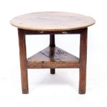 AN EARLY TO MID 19TH CENTURY OAK CRICKET TABLE 72cm diameter x 64cm high