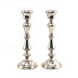 A PAIR OF SILVER KNOPPED CANDLESTICKS with marks for Birmingham 1975 with loaded bases, 27cm high