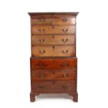 A GEORGIAN MAHOGANY TALLBOY with two short and six long drawers rasied on bracket feet 98cm wide x