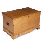 AN EARLY TO MID 20TH CENTURY PINE BLANKET BOX with twin wrought iron handles on a bracket base, 93cm