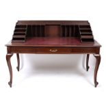 A MAPLE & CO MAHOGANY WRITING TABLE with red leather inset top, a single frieze drawer 159cm wide