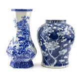 A 19TH CENTURY CHINESE BLUE AND WHITE BALUSTER VASE decorated with prunus blossom, with a Kangxi