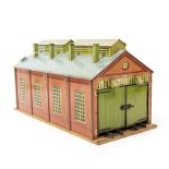 A HORNBY TIN PLATE 'O' GAUGE LOCOMOTIVE SHED with double doors to either end 49.5cm long x 23cm wide