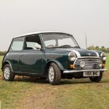 A MINI COOPER TWO DOOR SALOON AUTOMOBILE the two axle rigid body in green and white, 1275cc engine