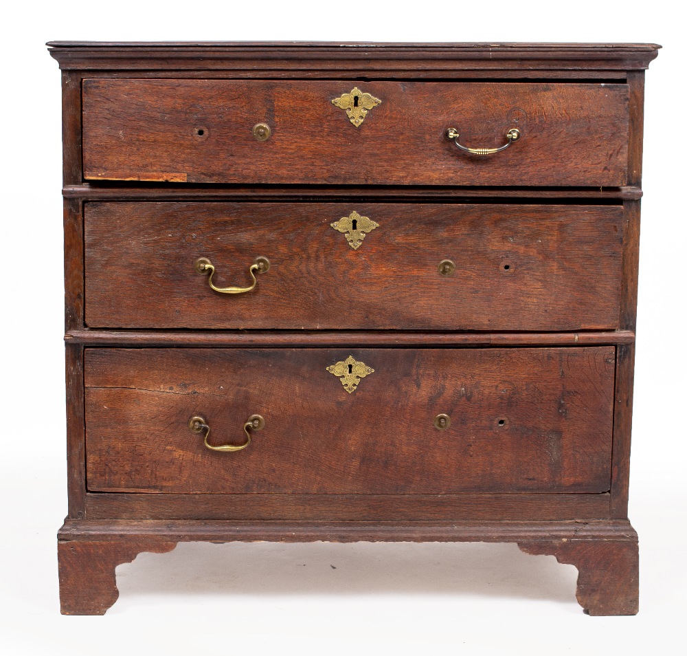 AN 17TH CENTURY OAK CHEST of three long drawers raised on bracket feet 94cm wide x 57cm deep x
