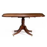 A REGENCY MAHOGANY AND ROSEWOOD CROSS BANDED TILT TOP BREAKFAST TABLE with four sabre supports and