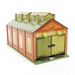 A HORNBY 'O' GAUGE TIN PLATE ENGINE SHED with twin doors to either end, 49.5cm long together with