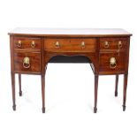 A 19TH CENTURY MAHOGANY BOW FRONTED SIDEBOARD with five drawers having lion ring handles and