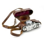 A LEICA 35MM NO.314806 FILM CAMERA in unassociated Leica case with original paper manual or