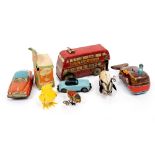 A GROUP OF TIN PLATE TOYS to include a clockwork British pig, an early Japanese clockwork bird,