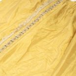 THREE PAIRS OF SILK ZOFFANY YELLOW OR GOLD CURTAINS with a handmade braid trim and fringe tasselling