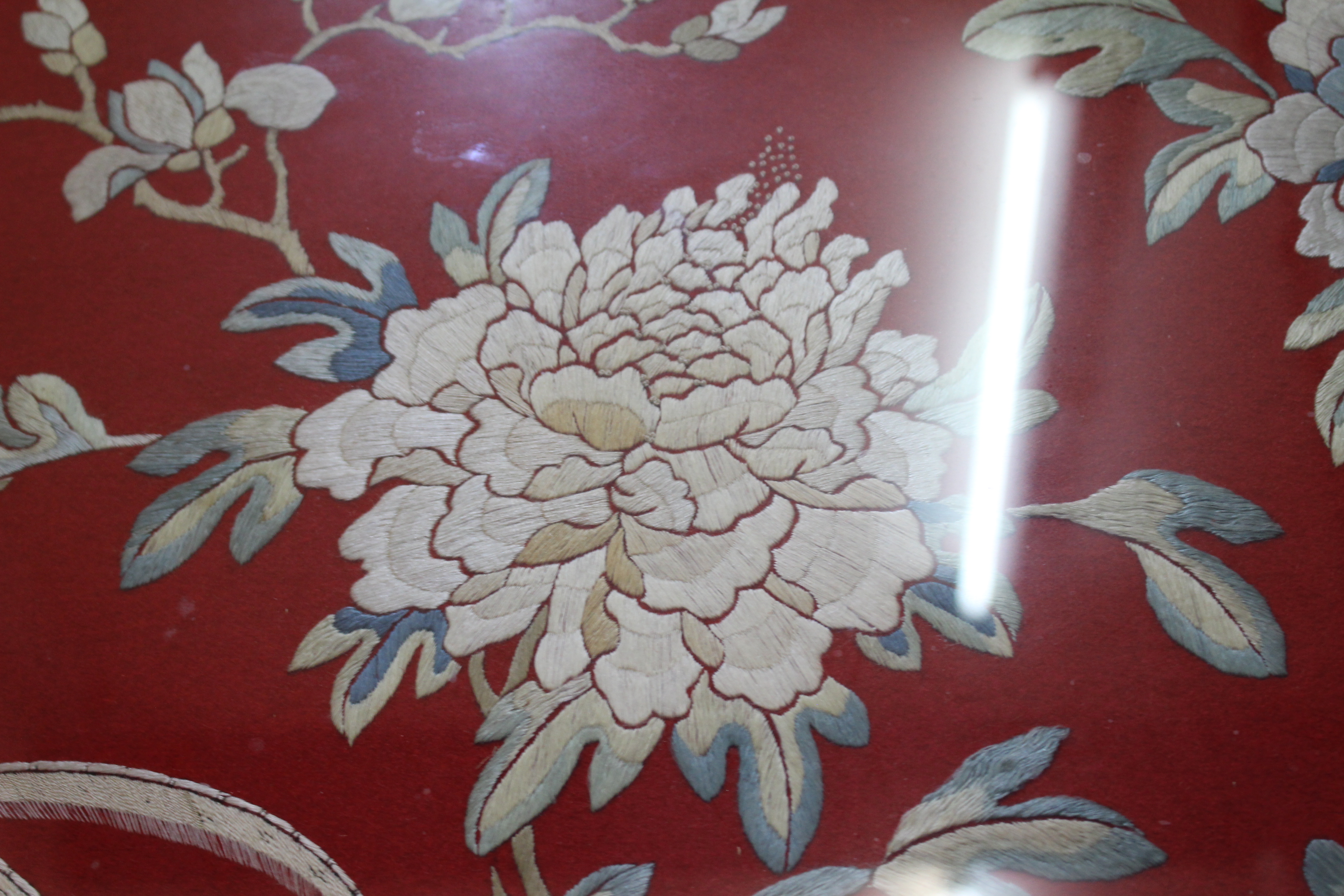 A CHINESE EMBROIDERED PANEL of phoenix amongst branches and flowers on a red felt ground, 56cm x - Image 4 of 10