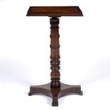 A REGENCY MAHOGANY RECTANGULAR TOPPED ADJUSTABLE TABLE with gallery, ring turned support and