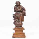 A CONTINENTAL CARVED WOODEN SCULPTURE OF A SAINT, 19cm high