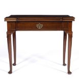 A GEORGE III MAHOGANY CARD TABLE with outset corners and conforming frieze drawer and turned