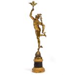 A GILT BRONZE SCULPTURE in the form of Icarus holding a lamp aloft and mounted on a drum plinth