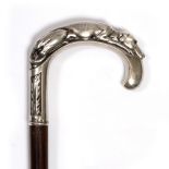 A CONTINENTAL WALKING CANE the white metal crook handle in the form of a greyhounds head with