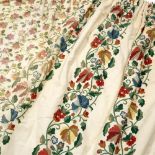 A PAIR OF EMBROIDERED OR CREWEL WORK PATTERN PRINTED CURTAINS on a cream ground 118cm in the drop