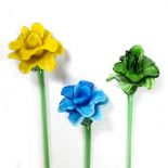 A SET OF THREE MURANO STYLE COLOURED GLASS FLOWERS each 69cm in length