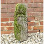 AN OLD SANDSTONE CARVING depicting the face of a bearded man 21cm wide x 55cm high