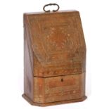 AN ANTIQUE GILT EMBOSSED LEATHER CORRESPONDENCE BOX with sloping front and carrying handle, 22cm