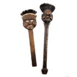 A PAIR OF EDWARDIAN CARVED WOOD NOVELTY BRUSHES each with a comical face, one inscribed '