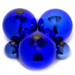 A SET OF THREE LARGE BLUE GLASS SPHERES each approximately 22cm diameter together with a further