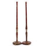 A PAIR OF RED LACQUERED STANDARD LAMPS with gilt chinoiserie decoration, the turned stems and