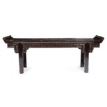 AN ORIENTAL BLACK LACQUERED ALTAR TABLE with scrolling ends 253cm wide x 51cm deep x 93cm high