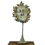 A 21ST CENTURY 'LEAF MASK' BRONZE SCULPTURE, signed with initials SC and dated '08, on an iron base,