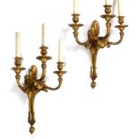 A PAIR OF ORMOLU THREE BRANCH WALL LIGHTS with acanthus leaf moulded decoration, wired for