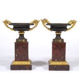 A PAIR OF FRENCH CHARLES VIII PERIOD BRONZE AND ORMOLU TAZZAS on rouge marble plinths 24cm wide x