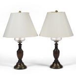 A PAIR OF CONTEMPORARY TURNED OAK AND BRASS TABLE LAMPS with faux glass reservoirs, each base 17cm