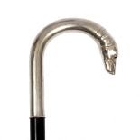 A CONTINENTAL WALKING CANE the white metal crook handle in the form of a greyhound with glass eyes