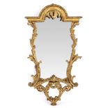 AN ANTIQUE VENETIAN GILT WALL MIRROR with arching crest and acanthus leaf scroll, moulded frame 50cm
