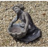 A SMALL ANTIQUE LEAD SCULPTURE of a kneeling child holding a shell 30cm wide x 36cm high